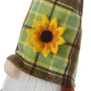 Detailed views of gnome plush showing green plaid hat, mini pumpkin, and felt texture