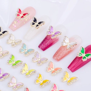 Exquisite butterfly nail charms with colorful drip oil wings and sparkling rhinestones