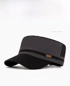 Detail of grey and black military flat cap showing cotton fabric and side leather patch