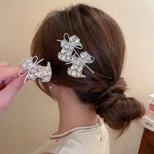 Sparkling rhinestone star puppy bow hair clips on a female hairstyle in close-up view