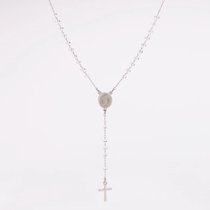 Detail of silver rosary necklace featuring transparent beads and a polished metal cross