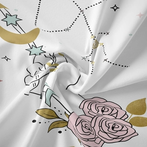 Detailed view of the rose and celestial print fabric with soft pleats and elegant drape