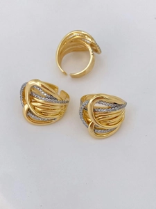 Detail of gold-plated open ring featuring multi-layer wrap design and pavé cubic zirconia