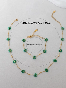 Detail view of flower necklace and bracelet set with size labels in centimeters