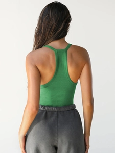 Rear view of a green rib-knit racerback tank top showing the detailed fabric texture