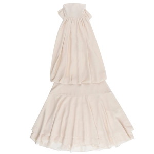 Detail of elegant beige halter chiffon dress showing high-quality fabric and layered hem