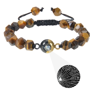 Detail of tiger eye stone bracelet showing multi-language I Love You projection feature