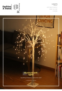 Detailed view of LED birch tree branches with warm glowing beads for cozy home decor