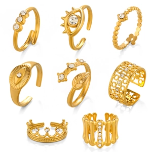 Set of 8 gold-plated adjustable open rings featuring devil eye and crown designs