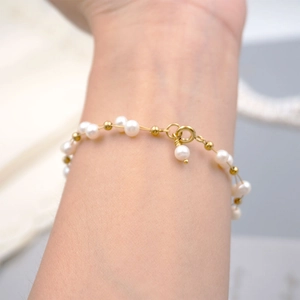 Elegant handmade freshwater pearl bracelet with gold beads and lobster clasp for women