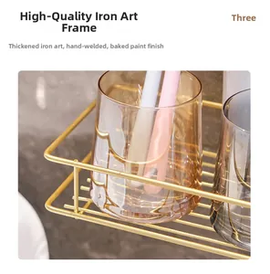 Detail of gold metal bathroom shelf showing thick iron frame and hand-welded craftsmanship