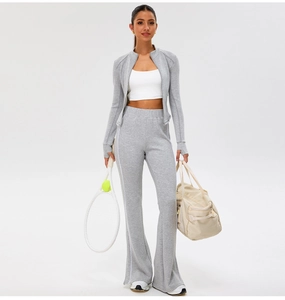 Slim fit gray yoga jacket and flared pants set with side stripes and thumbholes