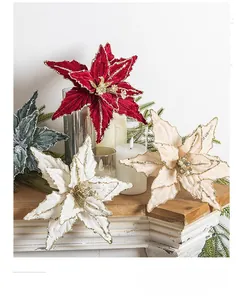 Detail of velvet poinsettia flowers with gold glitter edges for Christmas tree decor