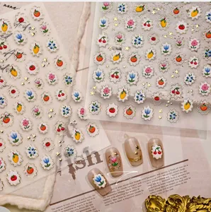 Detail view of M-1163 3D embossed fruit and flower nail art stickers with gold accents