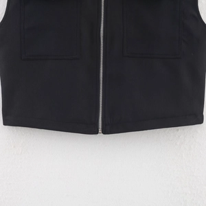 Women's black sleeveless jacket with silver metal zipper and symmetrical utility pockets