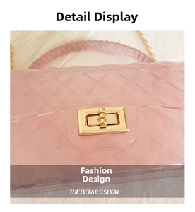 Detailed macro view of pink quilted jelly bag with golden clasp and chain strap