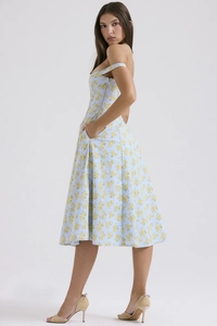 Detail view of a light blue floral dress showing a side pocket and back silhouette