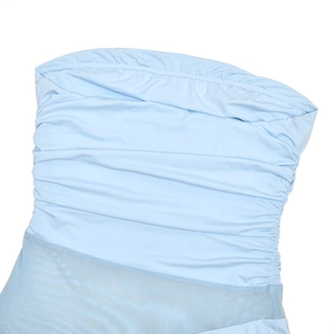 Detail of light blue strapless dress featuring ruched elastic bodice and sheer mesh paneling
