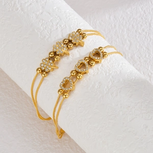 Vintage golden double-layer clover bracelet with sparkling rhinestones and adjustable clasp