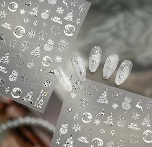Detailed silver embossed Christmas nail stickers with 3D reindeer and snowflake designs