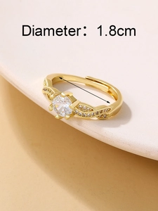 Detail of 1.8cm diameter gold crown ring with six-prong zircon and twisted band
