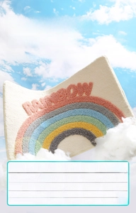 Detailed view of plush rainbow bath mat with 3D Rainbow letters on fluffy clouds