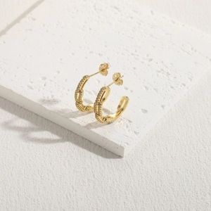Minimalist 14K gold plated C-shaped earrings with woven texture and sparkling zircon stones