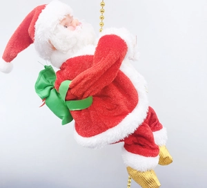 Detail of electric Santa Claus climbing a gold bead chain with a green gift bag