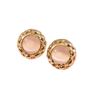 Vintage gold-plated button earrings with quilted texture and pink round stone center