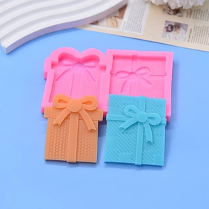 Pink silicone mold for gift box shaped chocolates and soaps with knit texture details