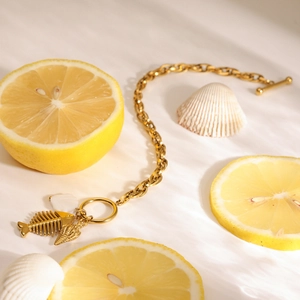18K gold plated stainless steel bracelet with fishbone and shell charms featuring OT clasp