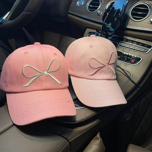 Pink cotton baseball cap with embroidered bow design for women, casual summer sun hat