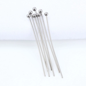 Macro view of polished stainless steel ball head pins for DIY jewelry making