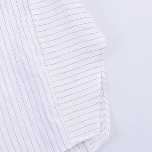 Close-up of horizontal black stripes on white fabric showing fine texture and side seam detail