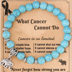 Blue turquoise stone bead bracelet featuring vintage silver elephant charm and heart accents