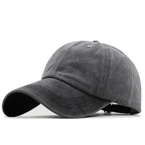 Detailed macro view of vintage washed grey cotton baseball cap with reinforced stitching