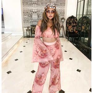 Women's two-piece floral off-shoulder crop top and matching wide-leg pants set in pink