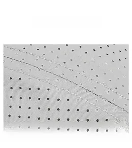 Detail of grey quick-dry fabric with circular ventilation holes and double stitching