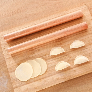 Solid wood rolling pin with natural grain on bamboo board for dumpling making