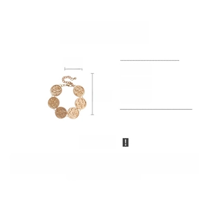 Detail view of 2.1cm textured metal discs on a 22cm gold-toned alloy link bracelet