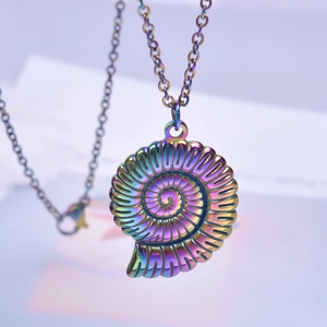 Macro detail of rainbow iridescent nautilus shell pendant with spiral metallic plating
