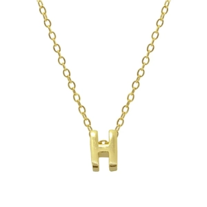 Detailed close-up of gold 925 sterling silver H-letter pendant on a delicate chain