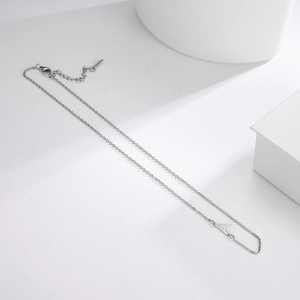 Minimalist silver stainless steel necklace featuring a stylish letter A pendant on white