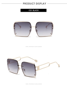 Front and side views of punk style square sunglasses with gold metal frame and gray lenses