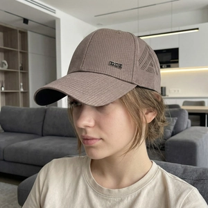 Men's breathable brown corduroy baseball cap with laser-cut holes and sports metal badge