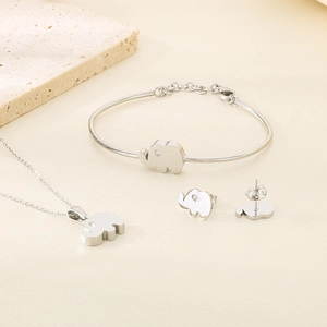 Detailed view of silver elephant jewelry set with necklace bracelet and stud earrings
