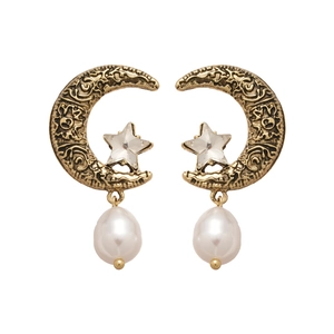 Vintage gold star and moon earrings with pearl pendants and crystals on a white background
