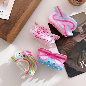 Cute printed acrylic hair claws set with heart and rainbow patterns for women