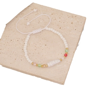 Handmade woven bracelet with irregular pearls and colorful crystal beads on stone