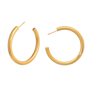 Close-up of minimalist 18K gold plated C-shaped hoop earrings with polished finish